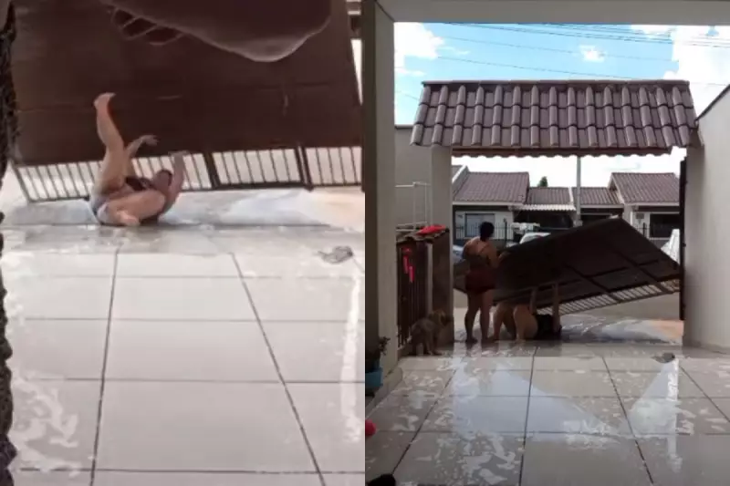 Mulher derruba portão em brincadeira para se refrescar no calor de 31°C