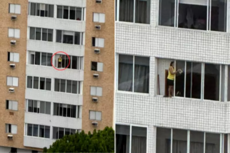 Mulher é flagrada em pé no parapeito de prédio durante limpeza em Santos, SP