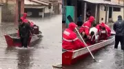 Lancha Resgata Idosa e Crianças em Rua Alagada de Parnaíba Após Chuva Intensa
