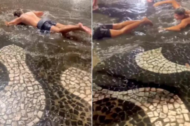 Calouros simulam natação em poças d'água durante trote universitário em Santos