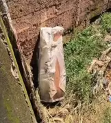 Chuva derruba muro de funerária e lança caixões em córrego em Bicas, MG