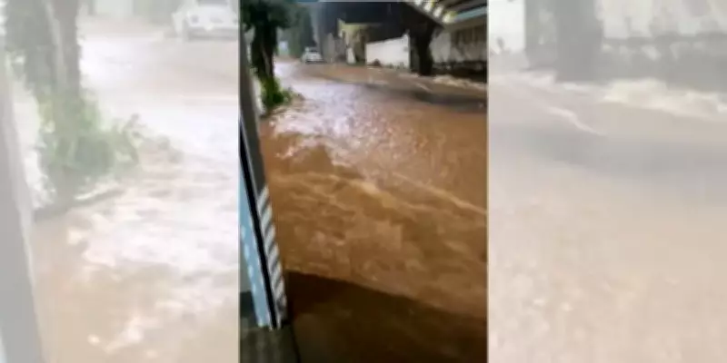 Chuva intensa em Tupã alaga ruas, destrói calçada e deixa veículo ilhado