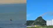 Helicóptero capta água do mar para combater incêndio no Morro do Boi, em Matinhos