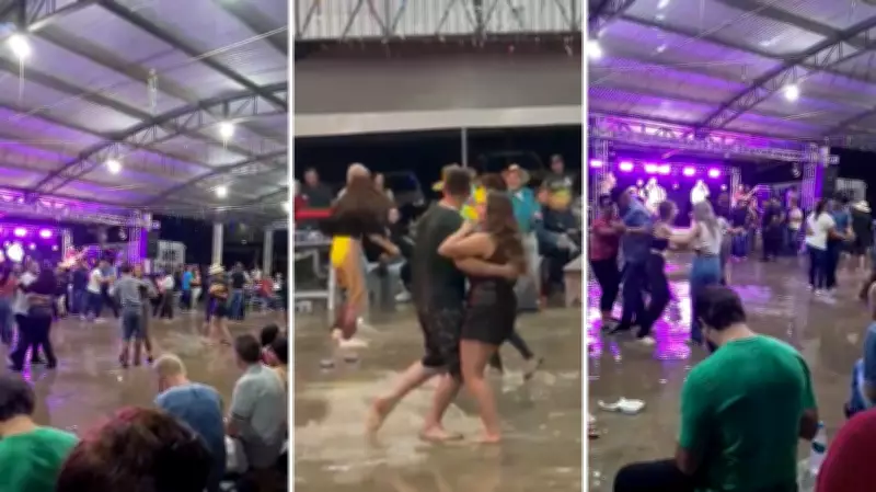 Chuva alaga baile no Paraná, mas público continua festa dançando na água
