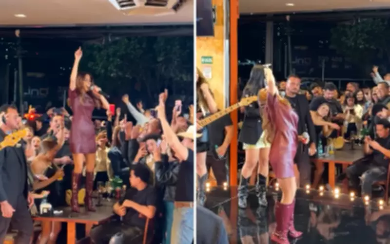 Maiara sobe em mesa de bar, canta e vira taça de vinho em Goiânia