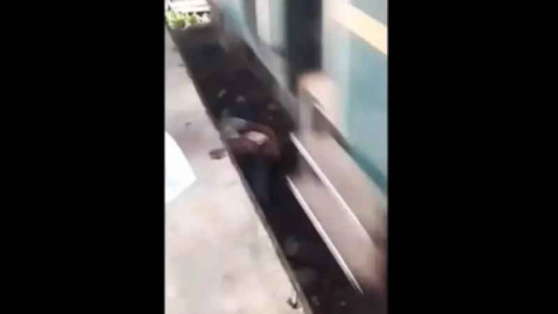 Pai pula nos trilhos para salvar bebê em Bangladesh e ambos escapam ilesos