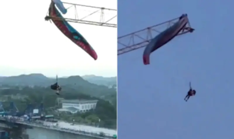 Parapentista fica preso a 60m em guindaste na China e é resgatado