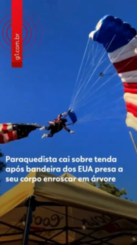 Paraquedista cai sobre tenda após bandeira dos EUA enroscar em árvore